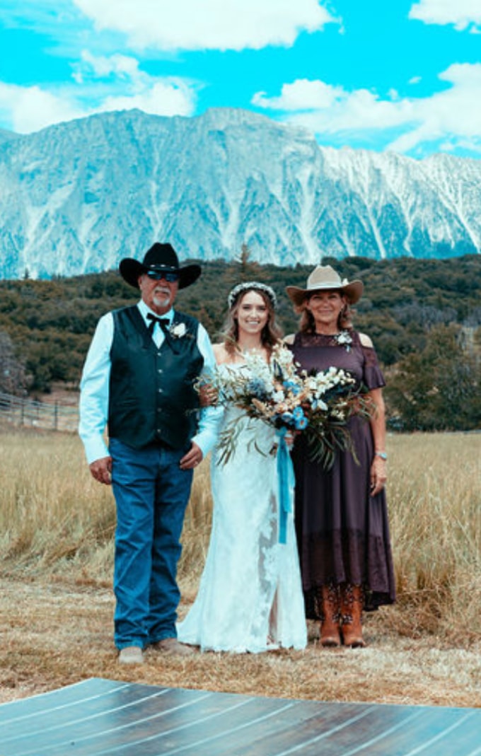 Bride with family in western attire against the Colorado mountains