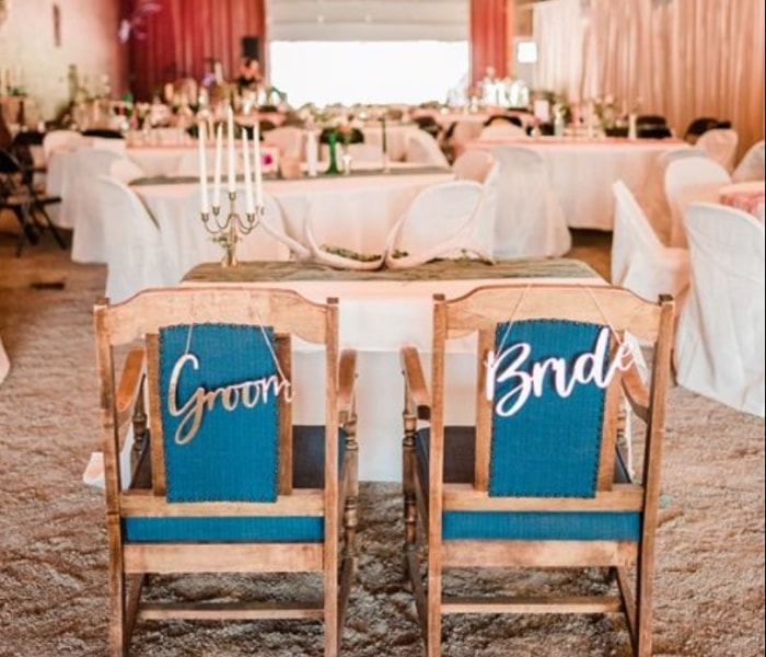 Elegant barn venue interior with string lights and rustic decor